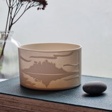 Load image into Gallery viewer, Porcelain tealight holder featuring an etched design of St. Michael’s Mount, creating a tranquil atmosphere with its natural coastal inspiration.