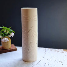 Load image into Gallery viewer, Porcelain cylinder Lamp etched with Gorse design in silhouette and words from the James Goodman poem Clay country. 
