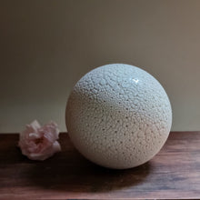 Load image into Gallery viewer, Spherical white textured lamp with pierced pinprick decoration. in natural light.