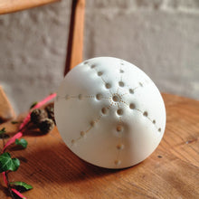 Load image into Gallery viewer, White porcelain Sea Urchin Porcelain Lamp with starburst design made with indentations.