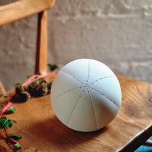 Load image into Gallery viewer, White Spherical Porcelain Lamp with starburst pattern made with dents and piercings.