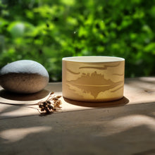 Load image into Gallery viewer, Handcrafted porcelain tealight holder with an intricate design inspired by St. Michael&#39;s Mount, capturing the iconic landmark’s beauty in soft light.
