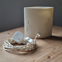 Load image into Gallery viewer, Porcelain lamp with a floral honeysuckle design, handmade by Amy Cooper. Featuring a braided cable.  
