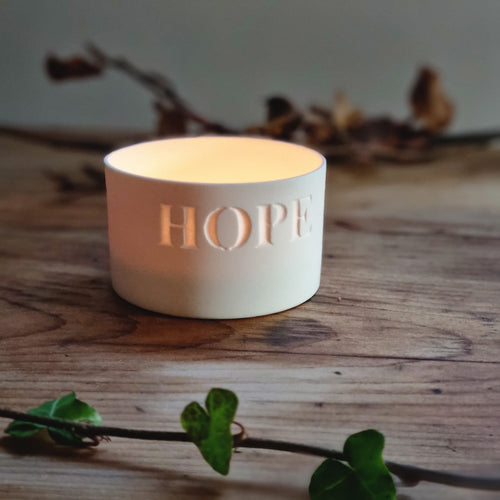 Porcelain Candle Pot etched with the word 'HOPE',