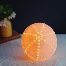 Load image into Gallery viewer, Glowing Porcelain Sea Urchin Lamp with textured glaze.
