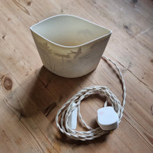 Load image into Gallery viewer, Handcrafted porcelain ellipse lamp inspired by meadows, with braided cable and plug. 
