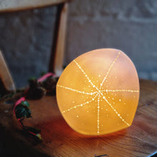 Load image into Gallery viewer, Glowing Orange Pointed Sea Urchin Lamp, star shaped design on diamond shaped lamp.
