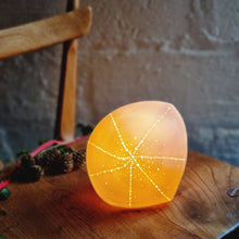 Load image into Gallery viewer, Glowing Orange Pointed Sea Urchin Lamp, star shaped design on diamond shaped lamp.
