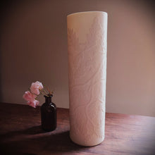 Load image into Gallery viewer, Unlit Porcelain cylinder Lamp etched with an Oak tree design in silhouette in shades of white. 
