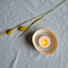 Load image into Gallery viewer, Creamy white porcelain spiral bowl with a lit tealight in it.
