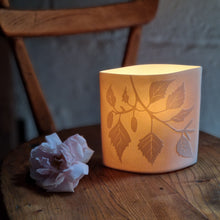 Load image into Gallery viewer, Elliptical porcelain Lamp with Birch silhouette design etched onto it. Glowing beautifully.
