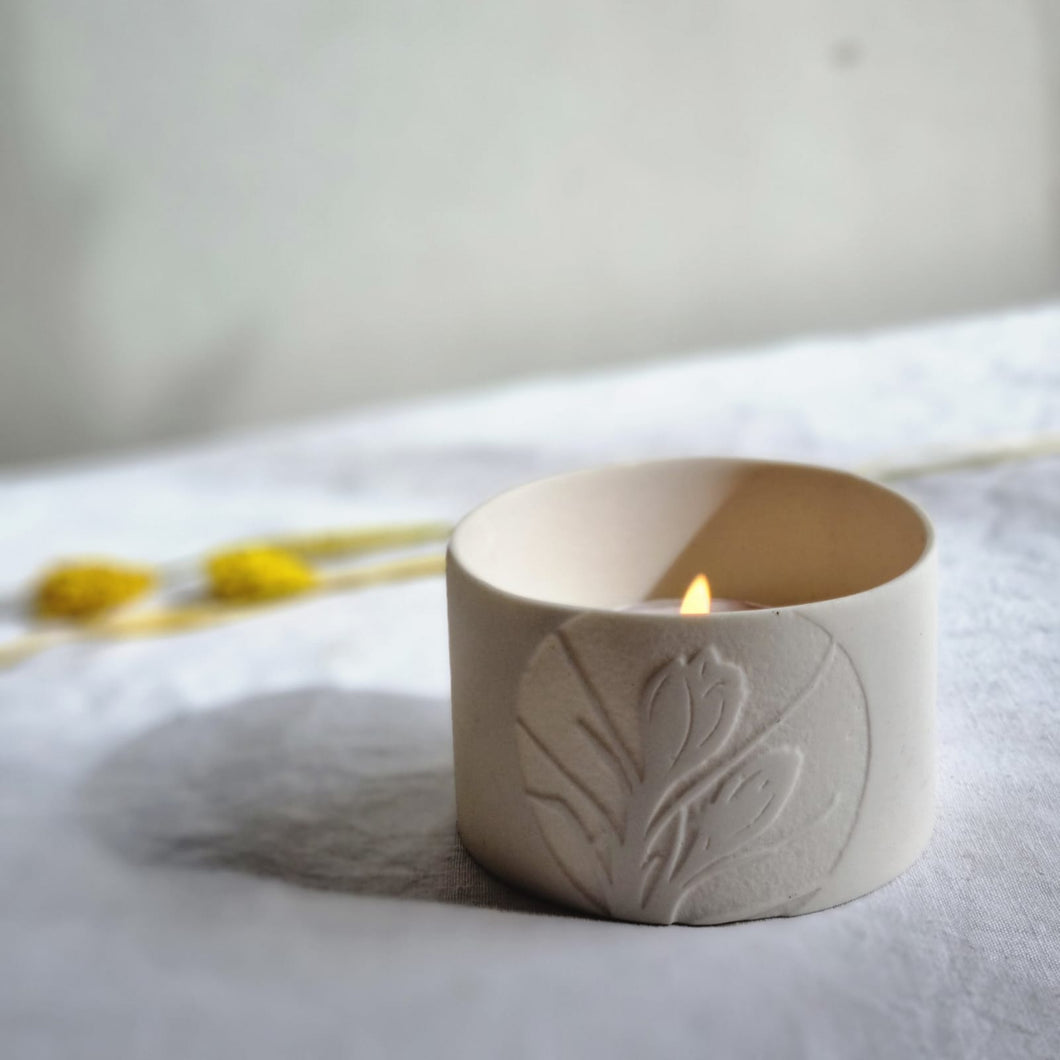 Pure white beaker with translucent Crocus decoration in relief.